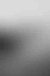 Cinematic black and white maternity photo with motion blur at Point Dume beach in Malibu.