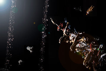Stroboscopic image of action figures thrown through the air. 
