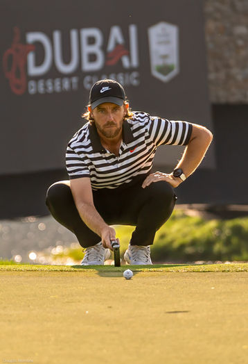 Tommy Fleetwood lines up a putt on the 13th hole, Hero Dubai Desert Classic, 2025