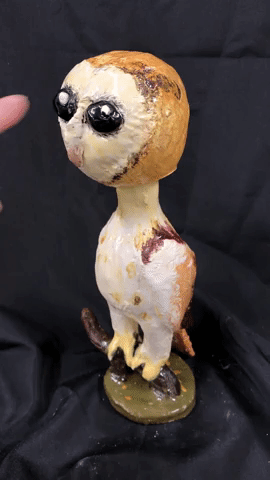 Video of student ceramic bobble head of an owl