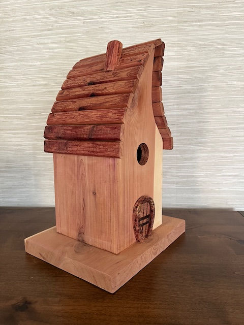 Handcrafted fairy tale cedar bird house with curved roof