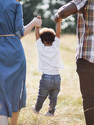 back-view-of-mixed-race-parents-walking-with-son-o-2021-09-14-16-14-49-utc.jpg