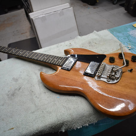 Gibson SG - refinish in natural, frets beveled, neck repair, truss rod adjustment, frets reseated, fret align, re-crown, new bone nut, new hand made pick guard.