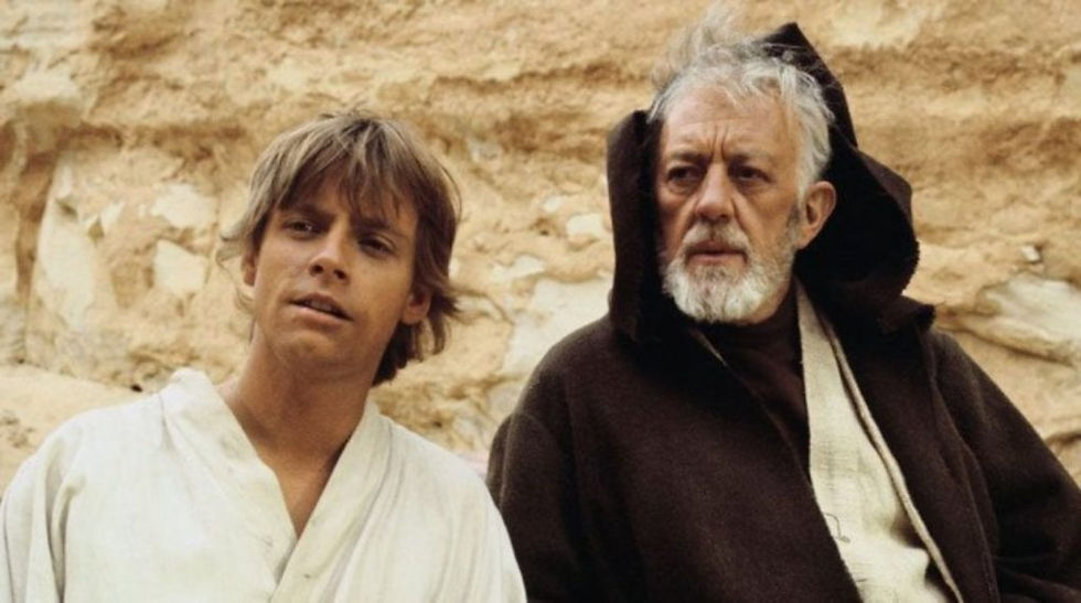 Luke Skywalker (Mark Hamill) with Obi Wan Kenobi (Alec Guinness)- Star Wars - Credit: Disney