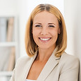 Woman Smiling in Suit