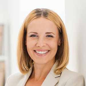 Woman Smiling in Suit