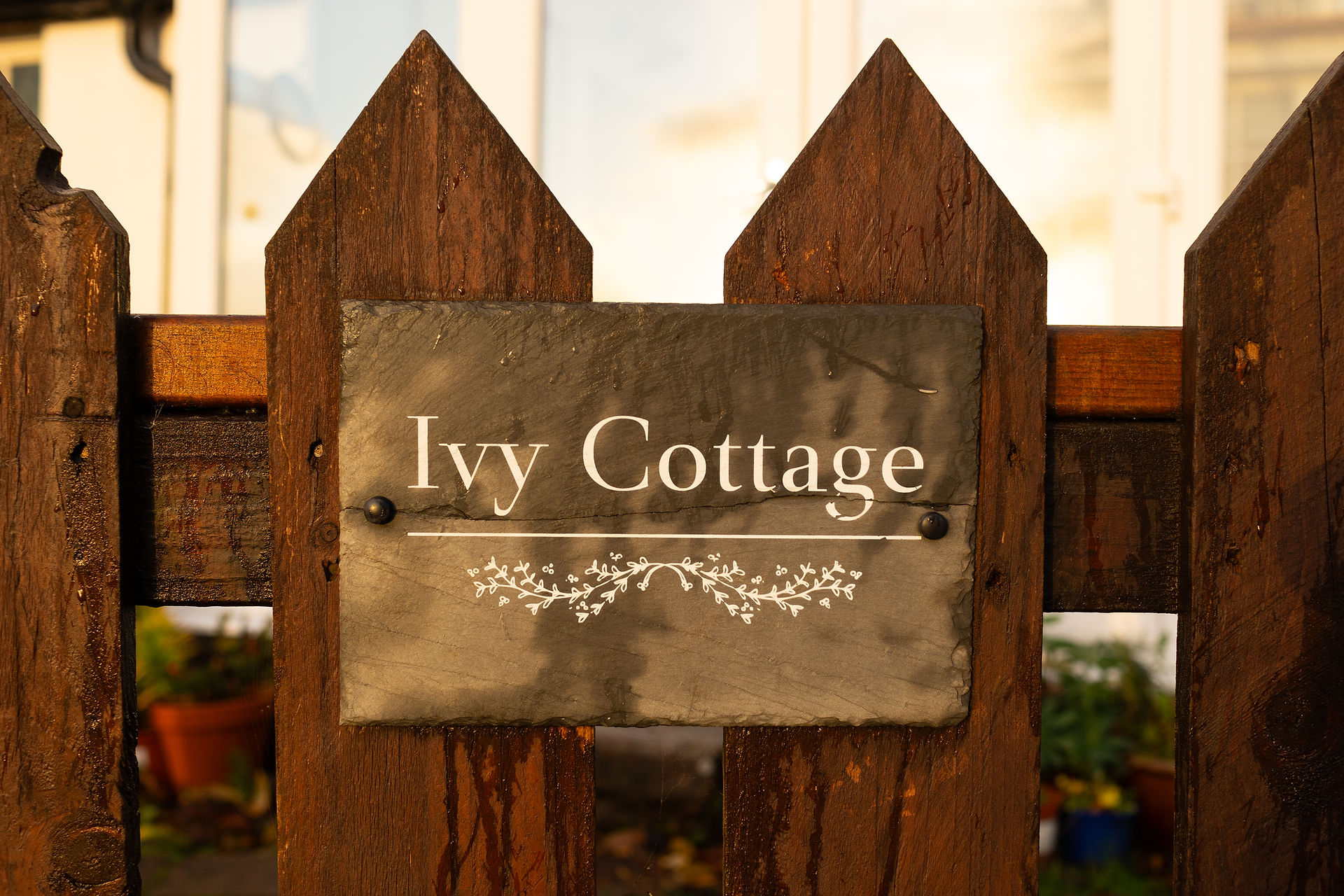 Sign with the words Ivy Cottage on the Isle of Rum