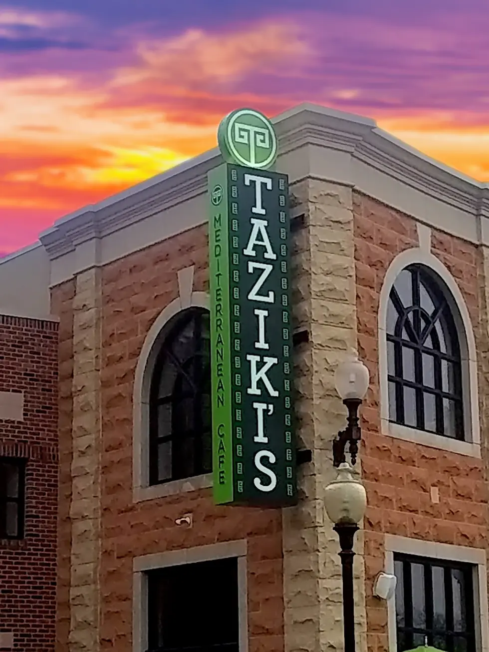 Tazikis Double-Sided Blade Sign. This sign features a unique design with push-thru lettering on three sides, and a Taziki's logo on top that is not only push-thru on both sides but is illuminated from the bottom of the logo.