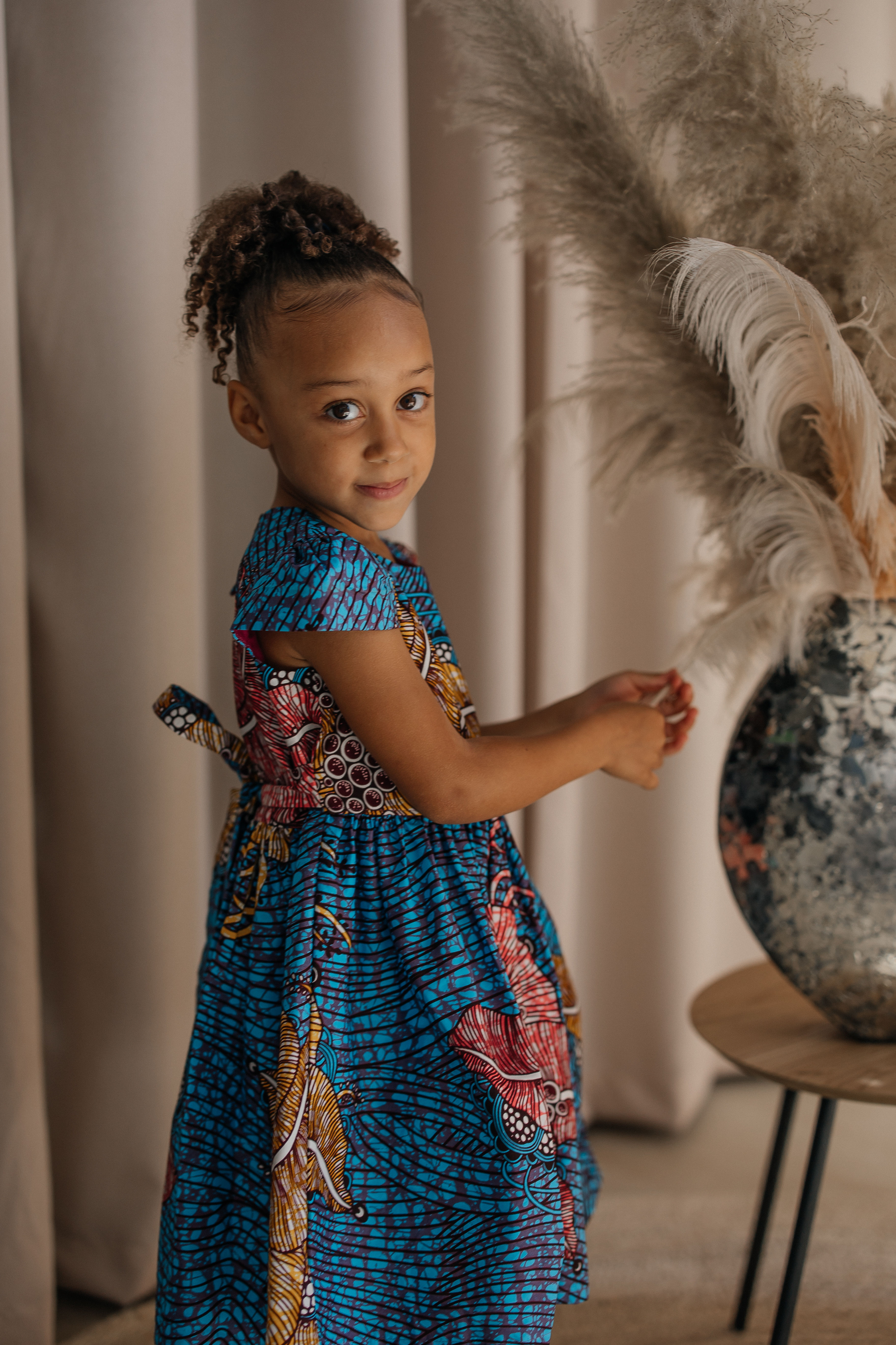 Orchids heart-shaped dress at the upper back has a snap closure