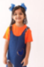 pinafore dress features denim on one side, and a beautiful white and blue wax print on the other side reverse