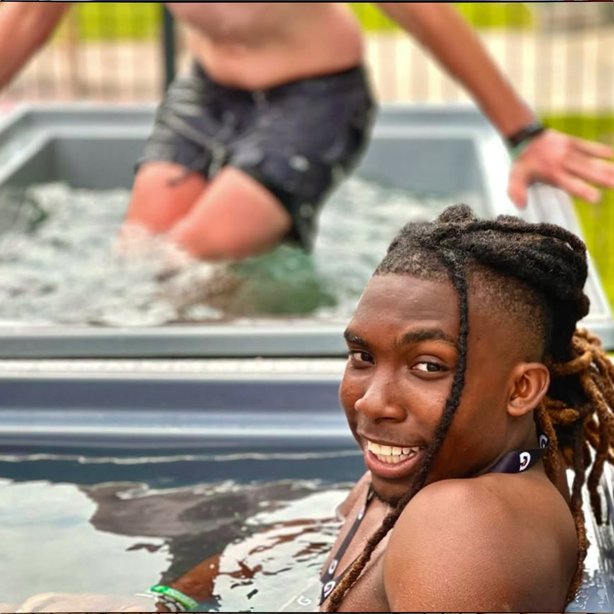 A camp participant enjoying the EMRJ cold plunge