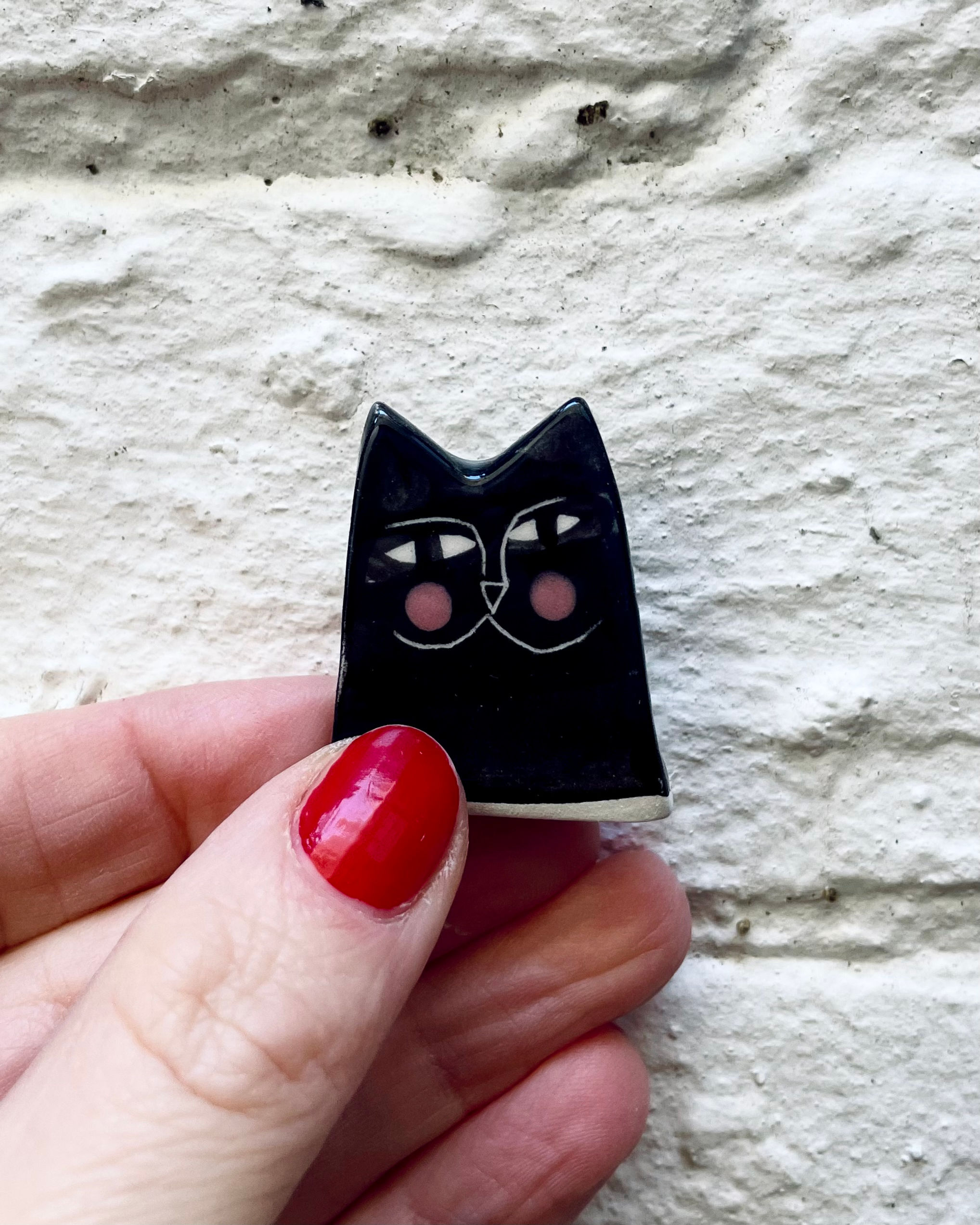 Tiny black cat, ceramic reverse figurine