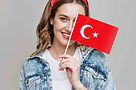 girl with turkish flag while smiling.jpg