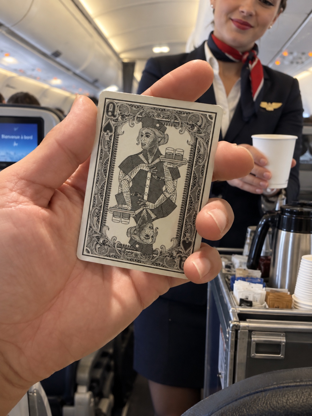 Frank Abagnale Queen of Spades playing card presented beside cabin crew during an airline flight
