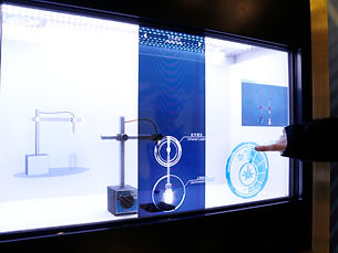 Transparent display showcasing items within illuminated setups
