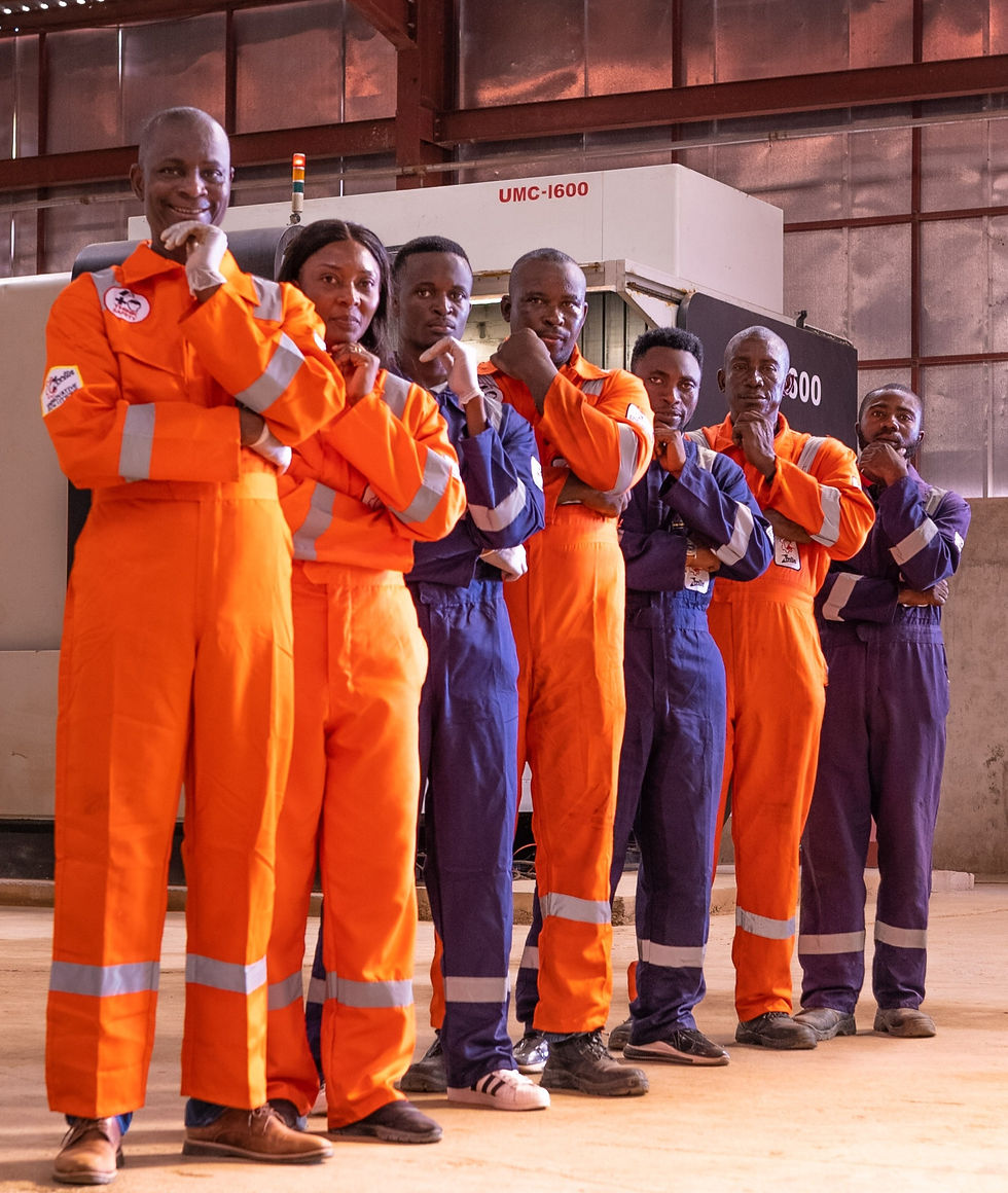 Azibaola Robert with Zeetin Technologies staff in orange overalls