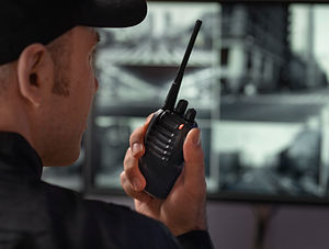 portrait-male-security-guard-with-radio-station-camera-screens.jpg