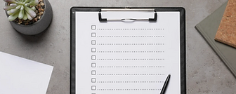 a clip board with a pen on it - symbol for CAP supervision services