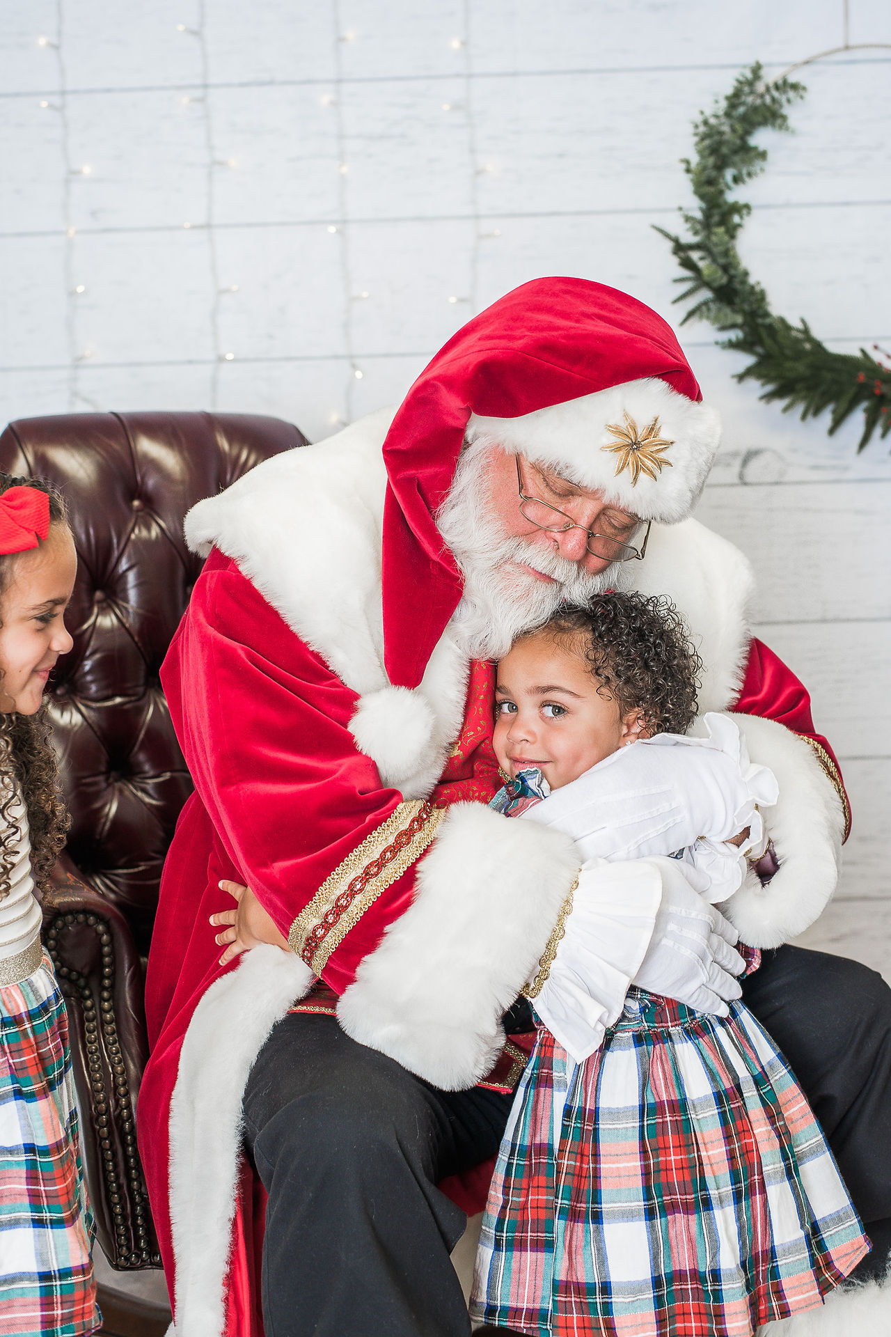 Girl hugging santa