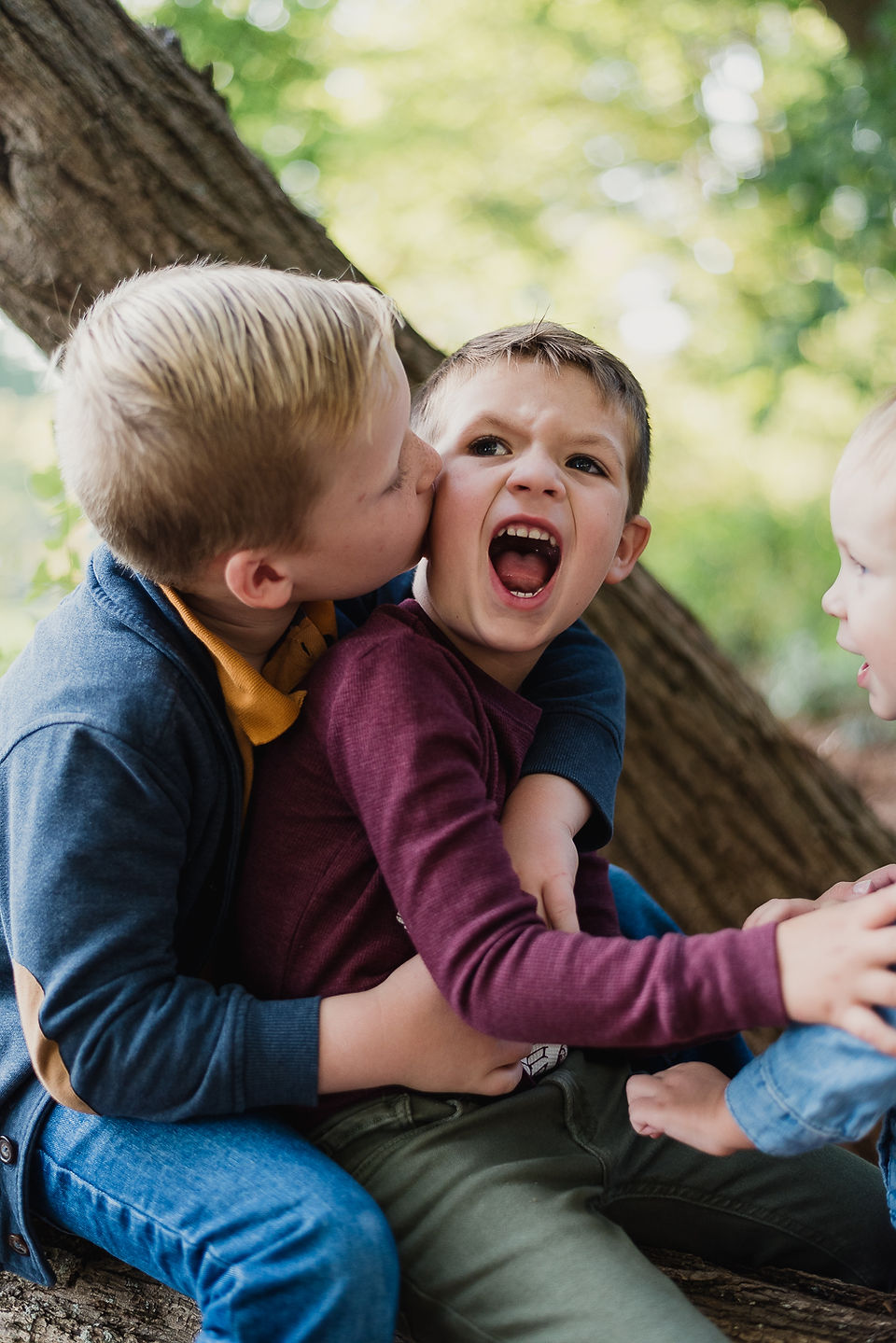 3 boys making funny faces