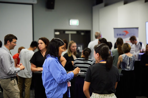 A busy room of health technology innovators at a Te Tītoki Mataora event