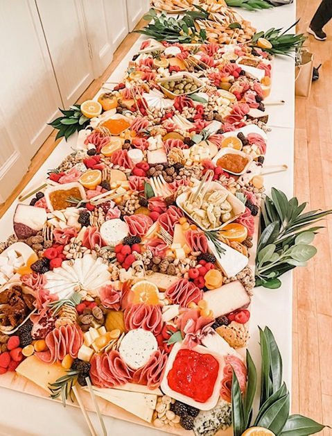 Wedding Reception Grazing Table including cheeses, charcuterie, fresh berries, assorted nuts, and more!