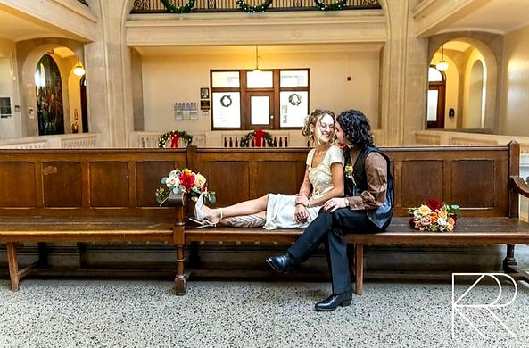 bride and groom elopement at city hall autumn asymmetrical handtied bouquets