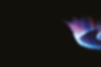 Intense flame of gas burner, blue and purple colors on black background.