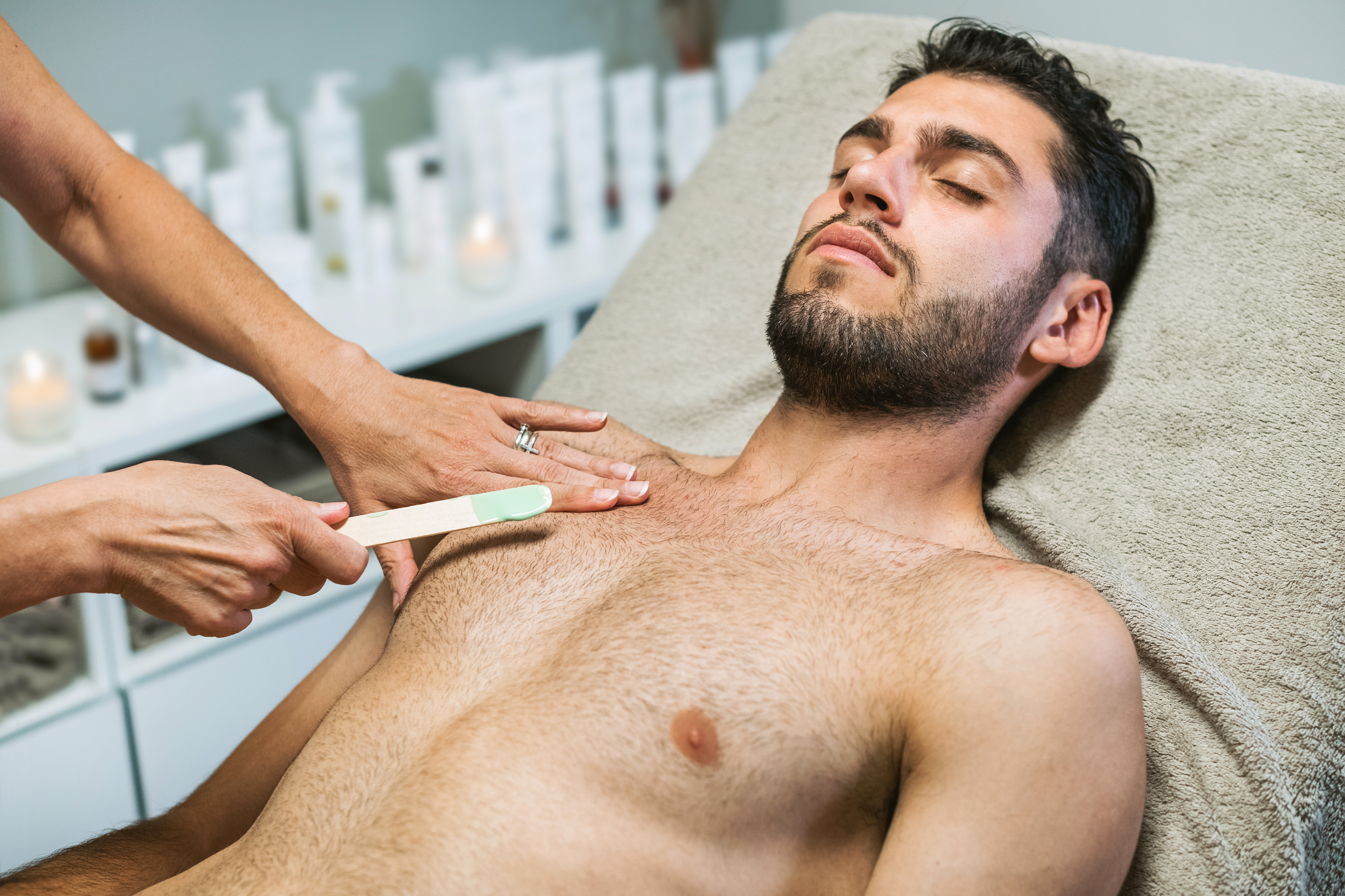serene-guy-getting-wax-hair-removal-from-chest-in-2023-11-27-04-54-47-utc.jpg
