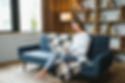 1920-smiling-young-woman-using-laptop-sitting-on-couch-at-home-beautiful-girl-shopping-or-