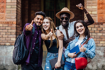 four-happy-students-near-university-campus.jpg