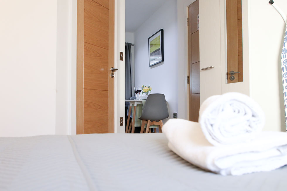 Folder towels on bed in Luxury Serviced Apartments Sydenham London