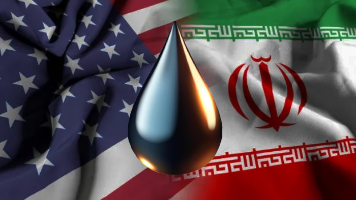 A black oil droplet is displayed over the US and Iran flags