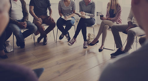 People sitting in a circle counseling.jp