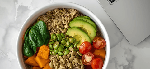 Bowl of healthy food at desk to support employee energy.png