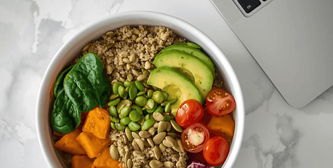 Bowl of healthy food at desk to support employee energy.png