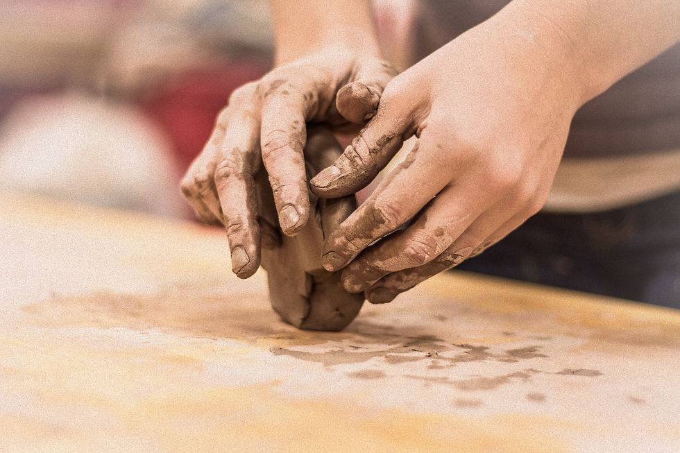 Hands Shaping Clay