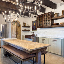 Farmhouse-style kitchen remodel in Nocatee by JHN Builders, featuring new countertops, custom millwork ceiling beams, updated lighting, new flooring, plumbing fixtures, appliances, and rustic wood finishes.