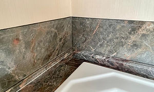 marble paint effect on wall to match real marble below.jpg