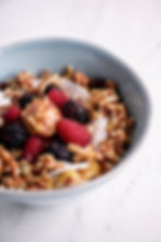 Thumbnail: banana almond butter smoothie bowl with mixed berries, cranberry seeds, almond butter, coconut and cranberry spice granola