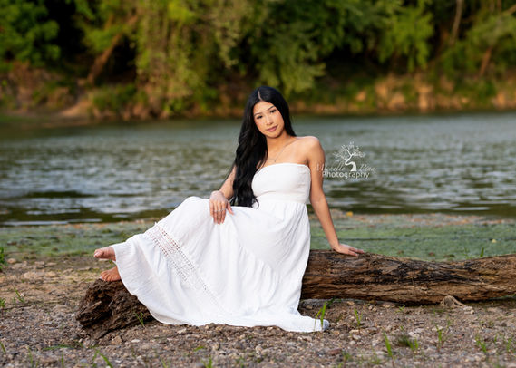 class senior photography  at a creek location using a white boho dress 