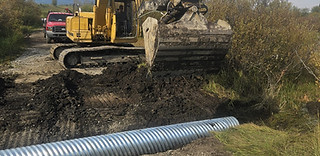 culvert install for proper drainage in Rocky View County