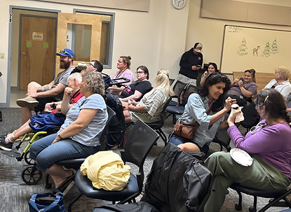 Group of people gathering together in a common room.