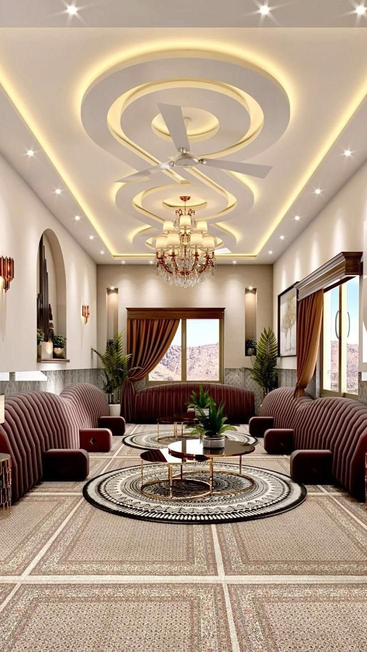 Luxurious living room with striped sofas, chandelier, ceiling fan, round rugs, curtains, and mountain-view windows.