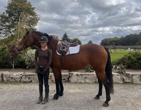 Rider with brown horse, ready for equestrian event wearing a Bedford-Jones belt