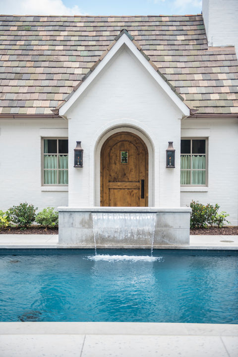 The front of a home designed by RPGA Design Group Inc. at sunset captured by Dallas photographer Tanner Garza on location in Fort Worth Texas.