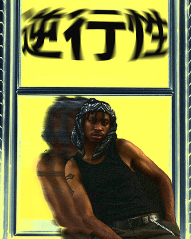 Man posing in front of blurred