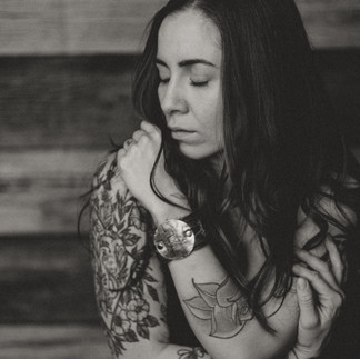 Monochrome portrait showing strong shadows and highlights on a thoughtful face.