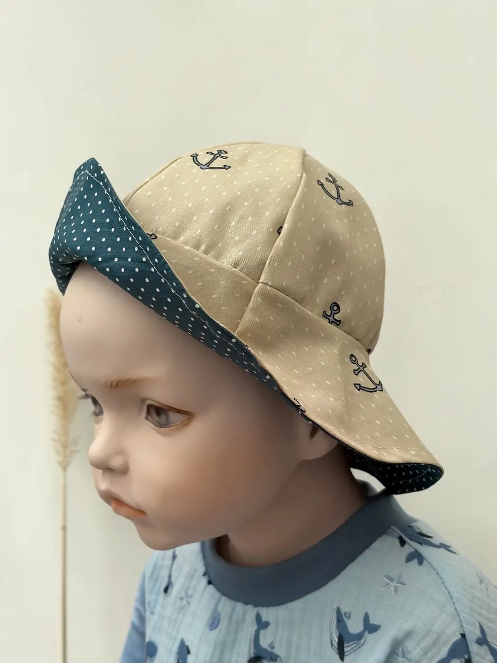 Wendbarer Sonnenhut Ankerliebe Beige Petrol für Babys und Kinder. Maritimer Baumwollhut mit Ankerprint und breiter Krempe