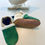 Miniaturbild: Handgefertigte Lederpuschen für Babys und Kinder in Petrol mit Creme Beige perfekt als Krabbbelschuhe und Lauflernschuhe.